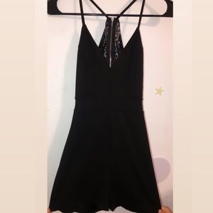 Black romper with open and lace back